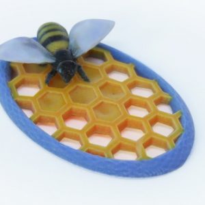 Pin featuring bee on honeycomb