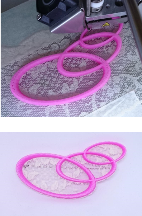 Sustainable Me! this image shows a pattern of 3 ovals being 3D printed onto white lace, and the finished brooch in pink filament framing the lace.